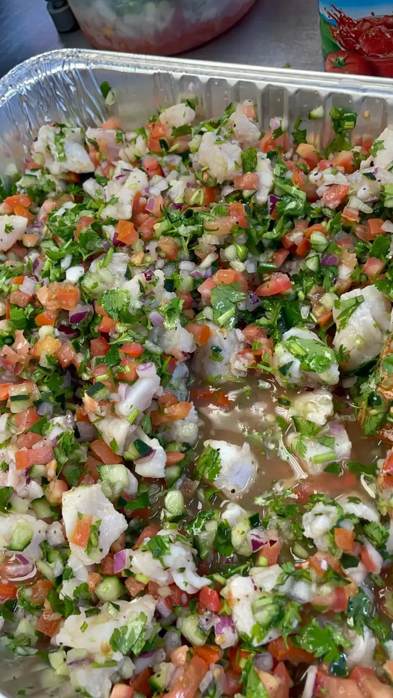 Fresh, colorful ceviche prepared in a catering tray